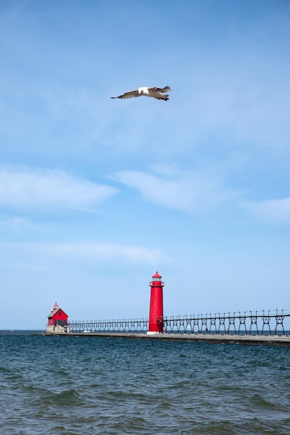 Landscape of the Grand Haven Lighthouse pier and catwalk Lake Michigan Michigan USA