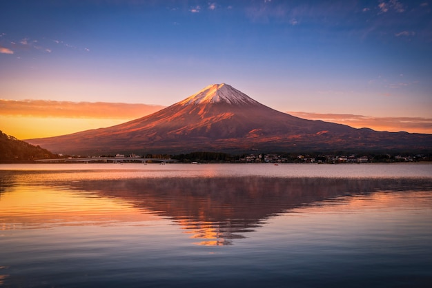 Landscape image of Mt. Fuji over Lake Kawaguchiko at sunrise in Fujikawaguchiko, Japan.