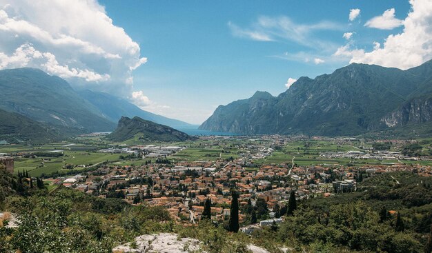 Landscape of an Italian town in a gorge against a background of large clouds and blue sky