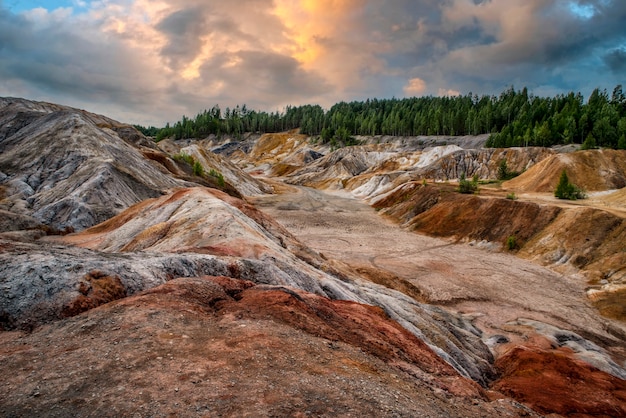 Landscape like a planet mars surface amazing sky beautiful clouds Ural refractory clay quarries