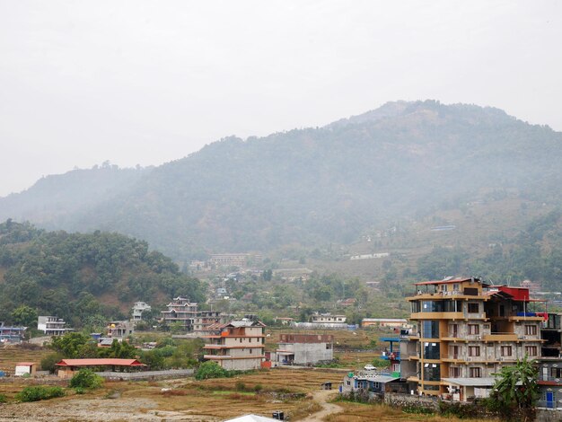 Landscape mountain and retro vintage building house cityscape Pokhara hill valley village at Gandaki Pradesh for nepali people and foreign travelers travel visit on December 7 2017 in Pokhara Nepal