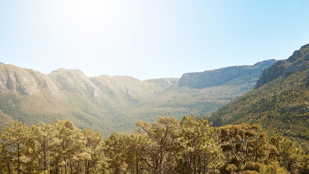 Landscape mountain view and blue sky with copy space in remote countryside eco nature and reserve for hiking exploring and walking Scenery of environmental and sustainable land with green forest