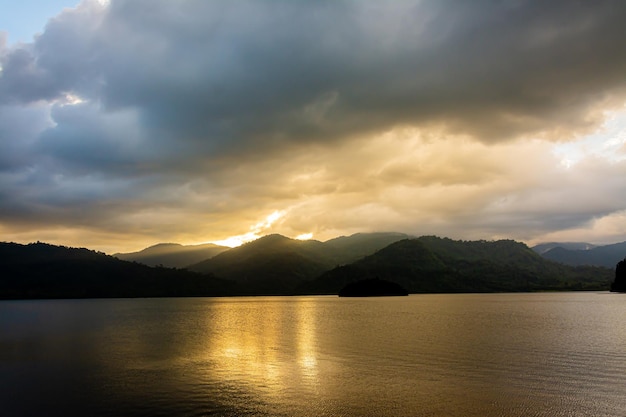 Landscape Mountain with colorful vivid sunset on the cloudy sky