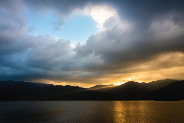 landscape Mountain with colorful vivid sunset on the cloudy sky