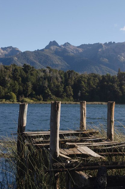 landscape of mountains and lake near Bariloche with a pier t