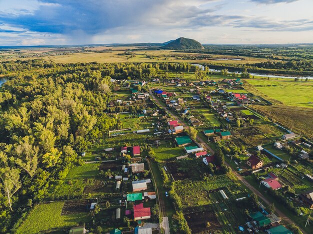 Landscape of oat field and village