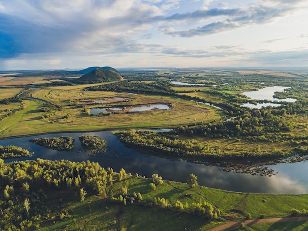 Photo landscape of oat field and village