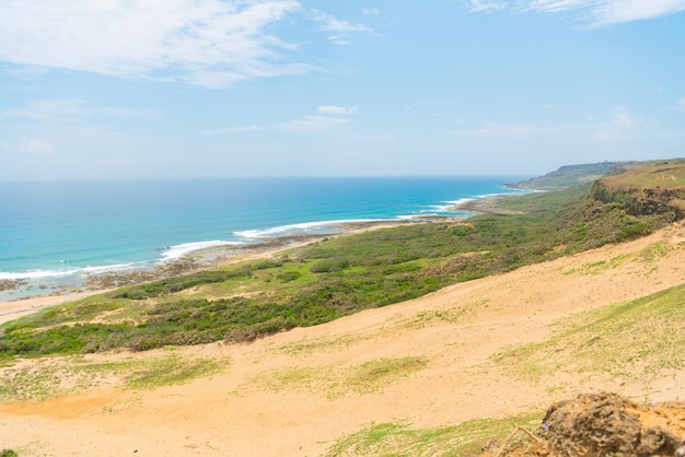 landscape photo of blue ocean sea water view and famous hiking hills mountain cover the clear sky and white wave with nobody.