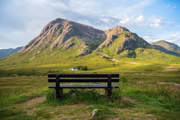 Landscape photography of mountains house and bench