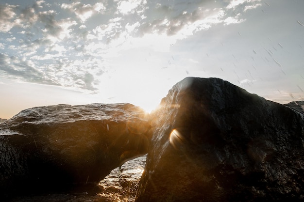 Landscape of the sea at dawn waves and splashes of water in the sun