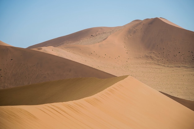 Landscape shot of singing sand on a sunny day