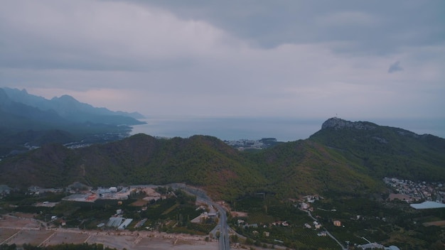 Landscape at sunset Aerial drone view of the resort town Clouds Mountains in the background