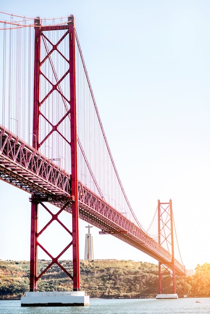 Landscape view on the 25th of April Bridge during the sunset in Lisbon city, Portugal