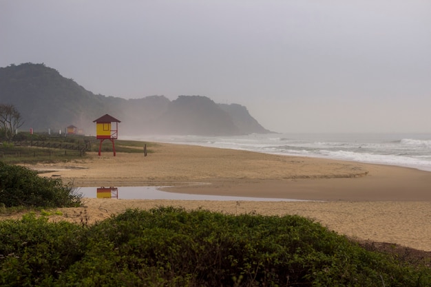 Landscape view from the beach coast. Foggy day