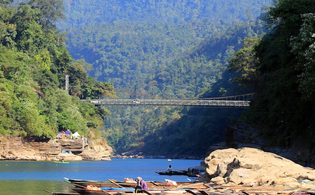 Landscape view of mountain and lake.blue water, boat, bridge\
etc.