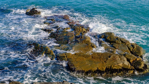 Landscape view sea waves splash on the rocks