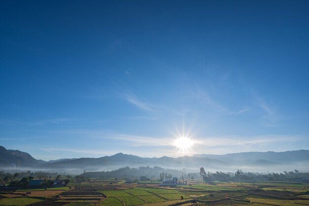 Landscape view of sunrise in the early morning and  sea of mist cover the mountian on the wat phuket temple viewpoint pua District nanPua  in the central part of Nan Province northern Thailand