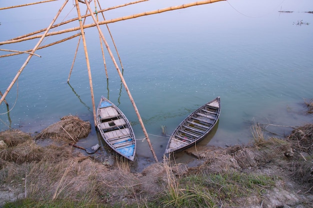 Landscape View of a wooden boat on the bank of the Padma river in Bangladesh