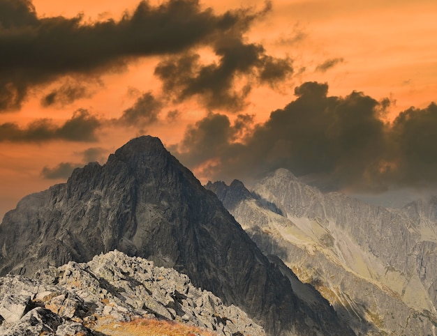 Landscape with dark rocky mountain ridge in sunset hour, High Tatra mountains