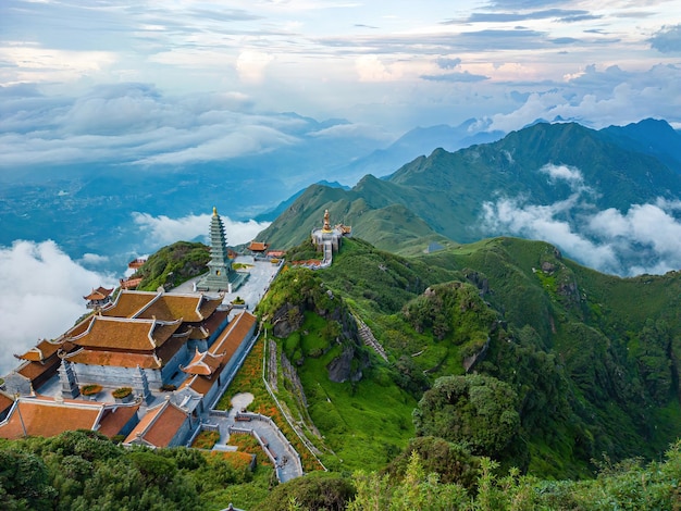 Photo landscape with giant buddha statue on the top of mount fansipan sapa region lao cai vietnam amitabha buddha statue on top of fansipan the roof of indochina travel concept
