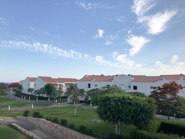 Landscape with the heights of Arab Muslim white stone buildings cottages houses with red tile creeks