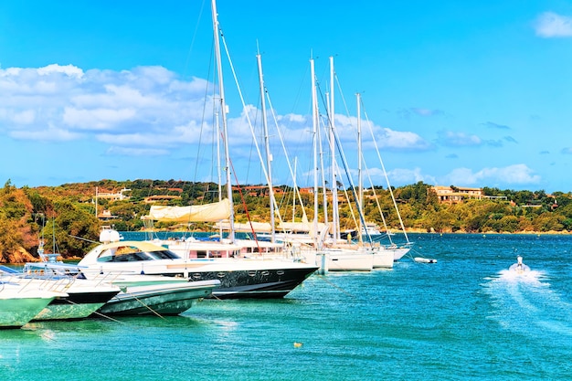 Landscape with Luxury yachts in marina of Porto Cervo resort, Costa Smeralda Sardinia, in Italy.