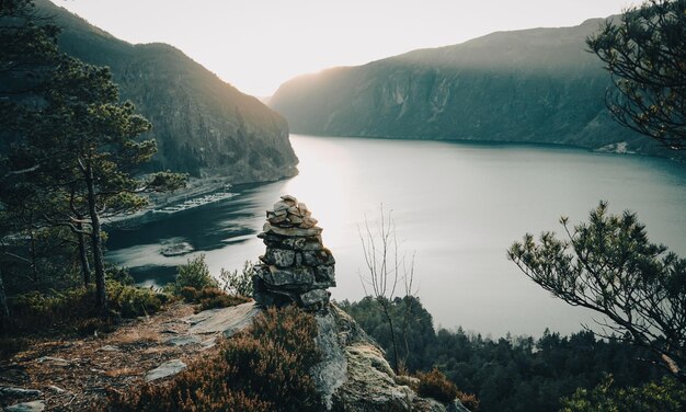 A landscape with a mountain and a lake in the background