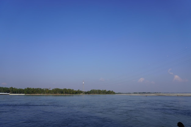 A landscape with river in sunny day clouds in the sky over the river