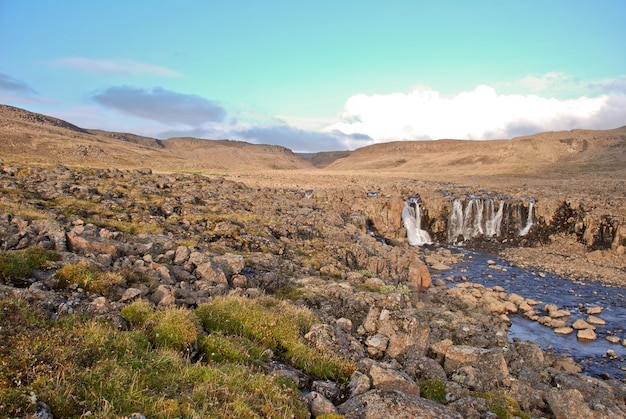 Landscape with rocks and a waterfall