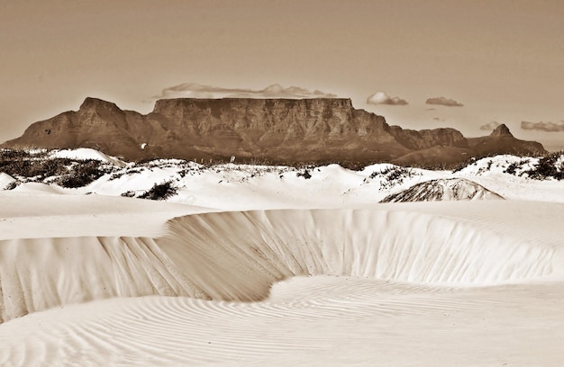 Landscape with a sand dune and table mountain in sepia