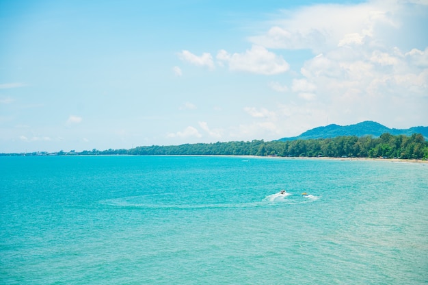 Landscape with white beach, the sea and the beautiful clouds in the blue sky