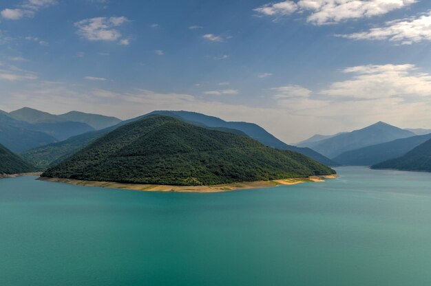 Landscape of zhinvali reservoir lake landscape with mountains along the main caucasus ridge in georgia