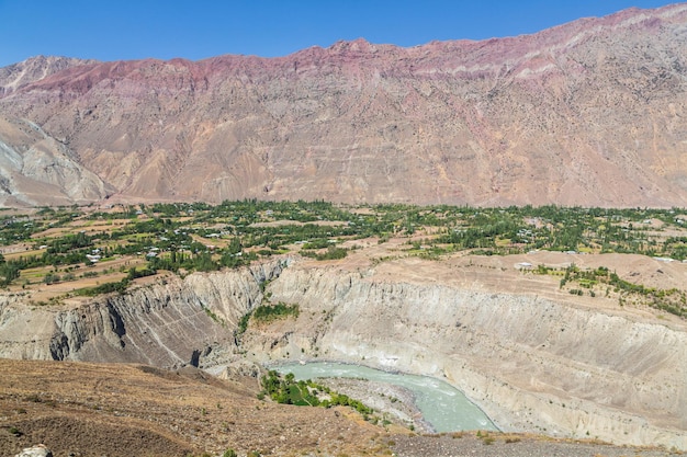 Landscapes of Hindukush mountains. Mountain ranges, gorges, river, valleys, villages. Pakistan