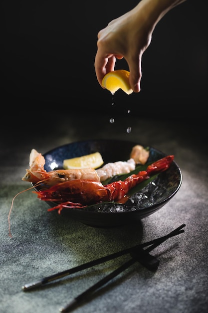 Langoustines on ice with lemon. Nice presentation of food in the restaurant