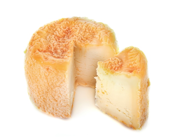 Langres cheese isolated on white