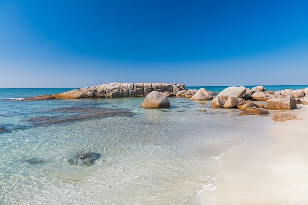 Lanscape view of white stones in blue sea.