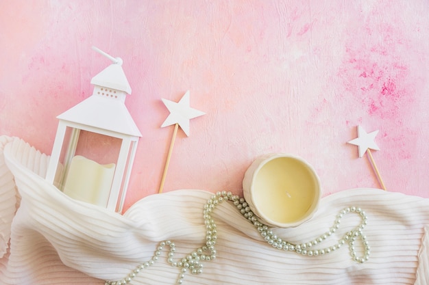 Photo lantern and candle on pink