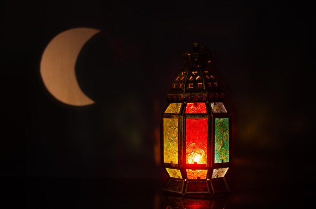 Photo lantern with moon shape from light on background for the muslim feast of ramadan kareem