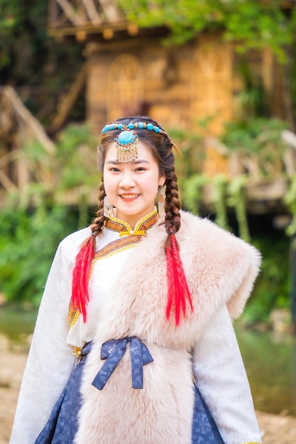 Lao Cai VIETNAM MAR 12 2023 Young beautiful girl wearing traditionally typical Mongolian dress culture of Mongolia in Cat Cat Village Sapa town