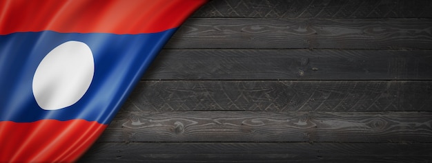 Laos flag on black wood wall