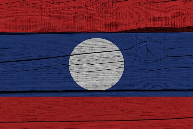 Laos flag painted on old wood plank