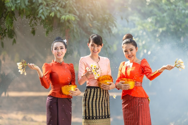 Laos girls splashing water during festival Songkran festival