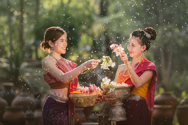 laos girls splashing water during festival songkran festival