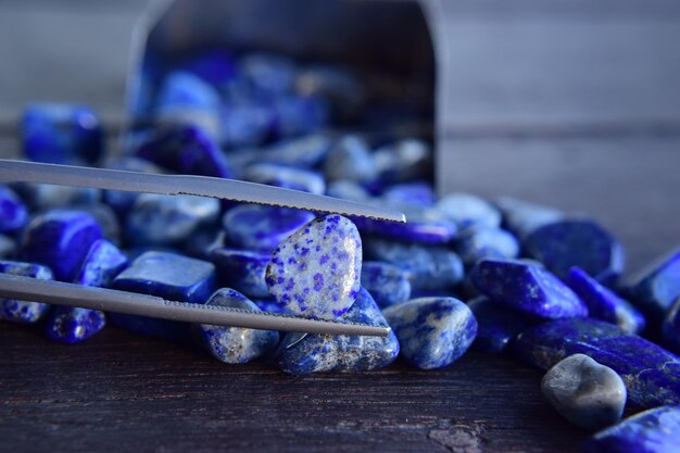 Photo lapis is a beautiful natural gemstone on a wooden floor
