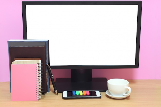 Photo laptop blank screen and books are placed on the desk and have copy space.