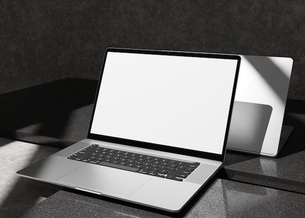 laptop blank screen on concrete plaster table