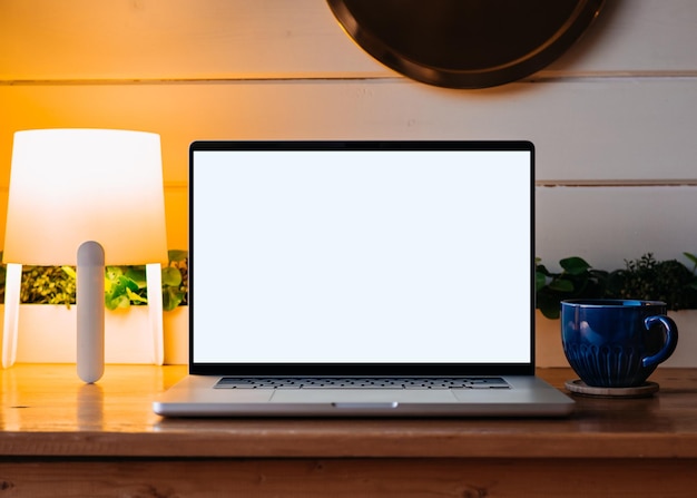 Laptop blank screen on wood table in country room mockup\
template