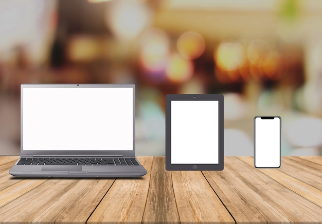 Laptop blank screen on wood table with blurred background mockup template for your text