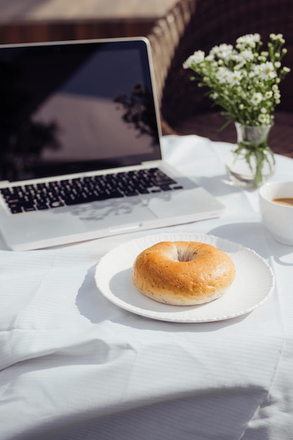 Laptop bread and cafe in coffee shop