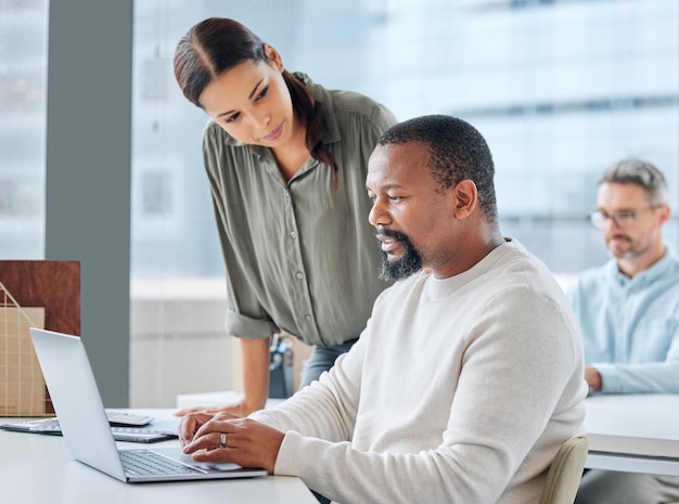 laptop business people and talking in office for teamwork planning and mentor for learning employees manager and training in workplace speaking and support for online research or proposal